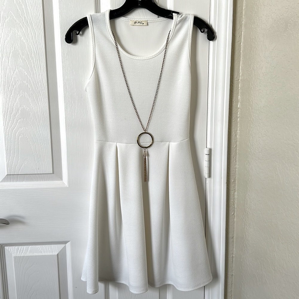 White dress , never worn, size S, includes attached off gold necklace.